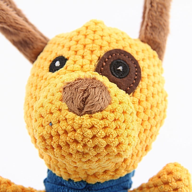 A pig toy shouts at a click to play for a dog