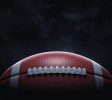 d-rendering-of-a-leather-ball-for-American-football-lying-with-its-seams-in-focus-on-a-dark-background.-_-x-