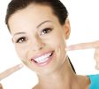 Woman showing her perfect teeth.