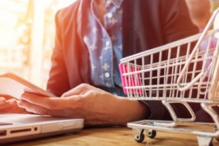cropped-image-woman-inputting-card-information-key-phone-laptop-while-shopping-online_-----------x---