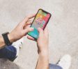 overhead-view-man-s-hand-using-social-media-app-mobile_-----------------x---