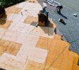 Roof repairs old roof replacement with new shingles of an apartment