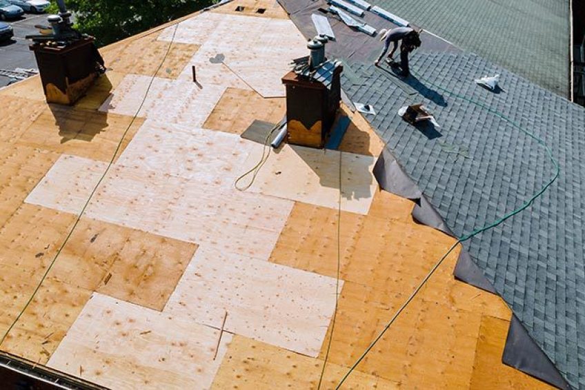 Roof repairs old roof replacement with new shingles of an apartment