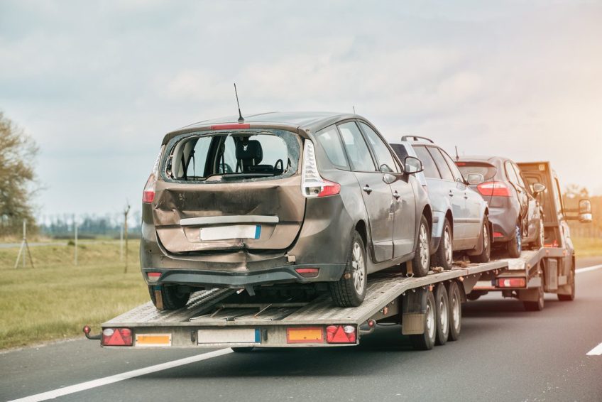 car-trailer-is-being-towed-by-tow-truck